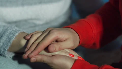 Man stroking a woman's hand, close-up, caring for a loved one Stock Footage 144638806