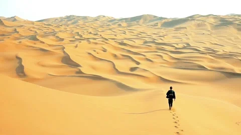 Man strolling through the desert Stock Footage 278013940