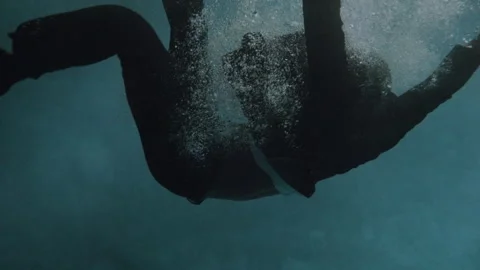 Man Struggles After Being Thrown Into Deep Swimming Pool at Night Stock Footage 208750390