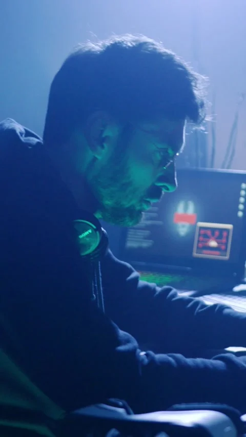 A man struggles for inspiration at his computer, embodying creativitys duality Stock Footage 313783482