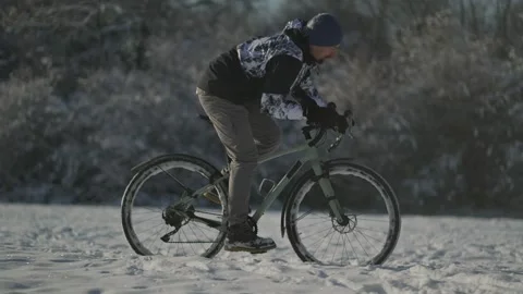 Man struggles through deep snow on off-road path, battling rough terrain and Stock Footage 292937310