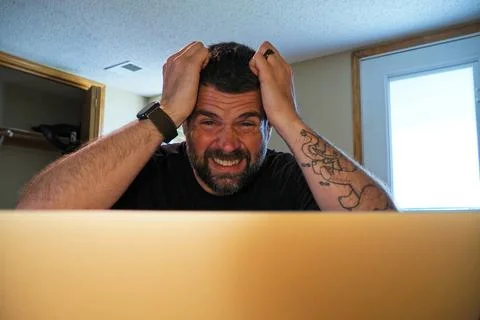 Man Struggling with Task While Working From Home Stock Photos