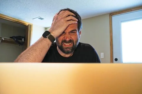 Man Struggling with Task While Working From Home Stock Photos