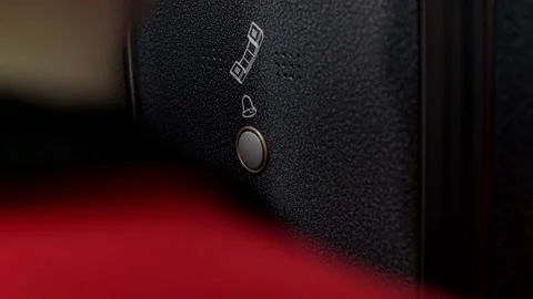 A man stuck in an elevator and presses the dispatcher call button, close-up Video stock 142378573