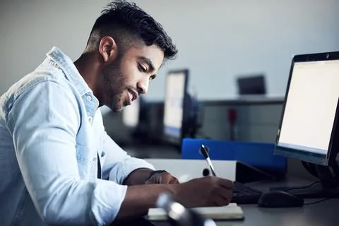 Man, student and thinking with writing in notebook at IT college with smile for Stock Photos