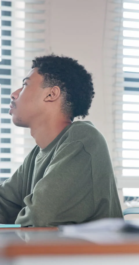 Man, student and writing in class with book, exam answers and studying for Stock Footage 340955272