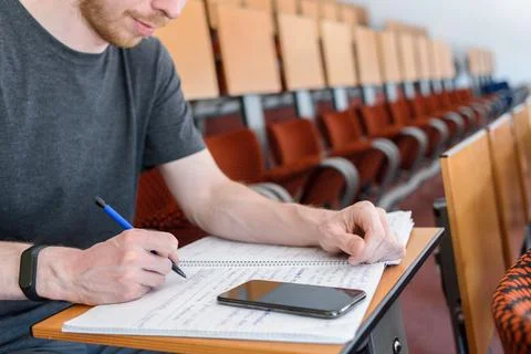 Man student in empty classroom Stock Photos