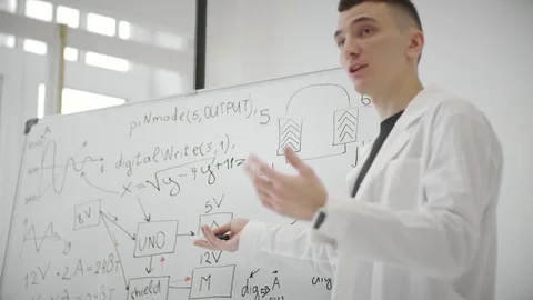 Man student explaining and showing mathematical formula and computational chart Stock Footage 83859447