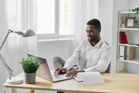 Man student freelancer american computer table laptop education office online Stock Photos