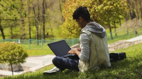 Man student programmer show thumbs up and working on laptop Stock Footage 100605406