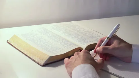 Man Studies The Bible Stock Footage 49981770
