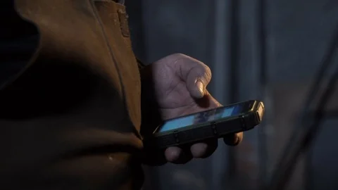 The man in the studio on the phone dials the number close-up 库存影片 69863371