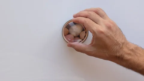 Man study meteorites pearls in magnifying glass, close up Stock Footage 91654999