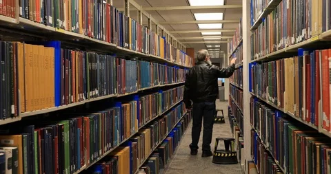 Man study research genealogy library books 4K Video stock 102417623