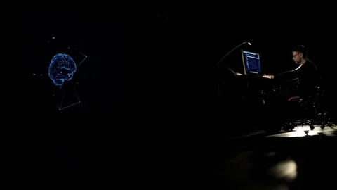 The man is studying the 3d model of the human brain. Stock Footage 77672072