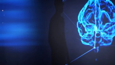 The man is studying the 3d model of the human brain.Artificial Intelligence. Video stock 77676501