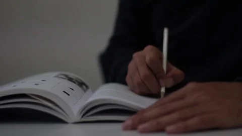 Man studying and underlines a book Video stock 85457778