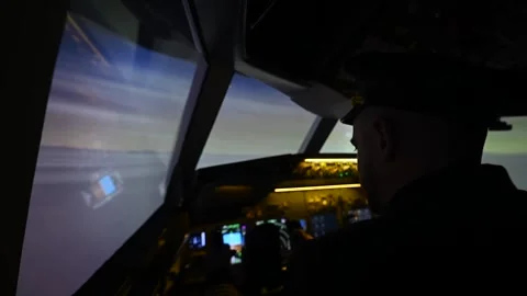 A man is studying to be a pilot in an aircraft simulator. Видео 246287307