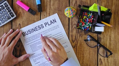 Man studying business plan. Top view 4k (UHD) Stock Footage 115855981