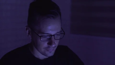 Man studying on the computer in the night Stock Footage 81081488