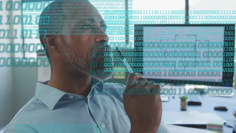 Man studying floor plan turning to screen, code overlay growing across frame, Stock Footage 333397094