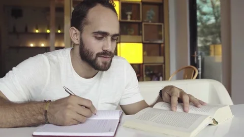 Man studying, preparing for exam Stock Footage 83188755