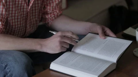 Man Studying Taking Notes In Book Video stock 49679150