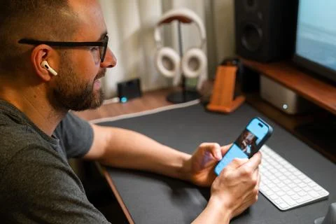 Man studying working from home using smartphone Stock Photos