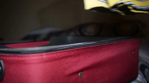 Man stuffing and preparing his suitcase Stock Footage 55621910