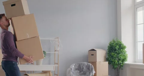 Man Stumbles and Boxes Tumble During Relocation Stock Footage 260917718