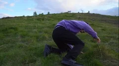 a man falling down an hill