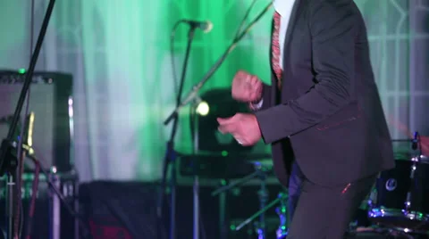 A man in a stylish suit dancing and clapping Stock Footage 39712522