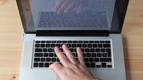 Man Successfully Unlocking Laptop After Multiple Attempts Stock Footage 331925800