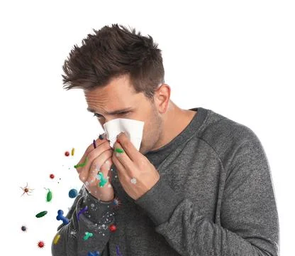 Man suffering from cold on white background. Microbes spreading Foto stock