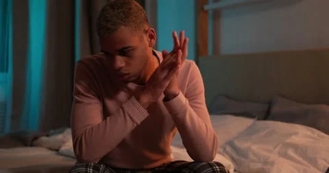 Man suffering from depression sitting on bed Stock Footage 145293100