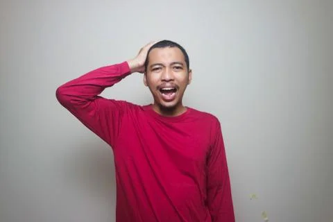 Man suffering from headache or thinking over white background Stock Photos