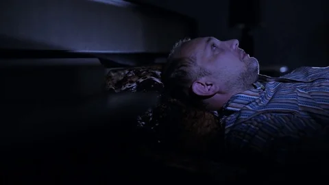 A man is suffering from insomnia Stock Footage 84741119
