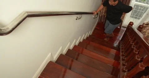Man suffering from low back pain while walking up the stairs. Stock Footage 276848798