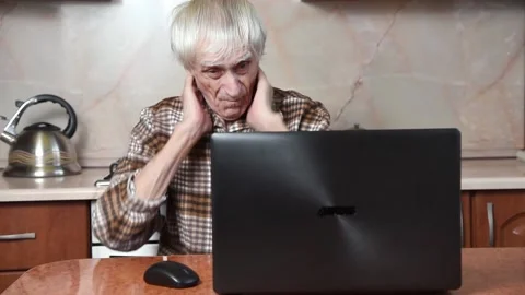Man suffering from pain in neck working at computer Video stock 177461395