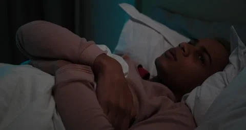 Man suffering from sleeping disorder lying on bed Video stock 145293594