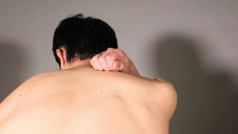 A man suffering from stiff shoulders Stock Footage 336666528