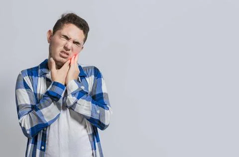 Man suffering with toothache or pulpitis. Concept of people suffering from... 스톡 사진