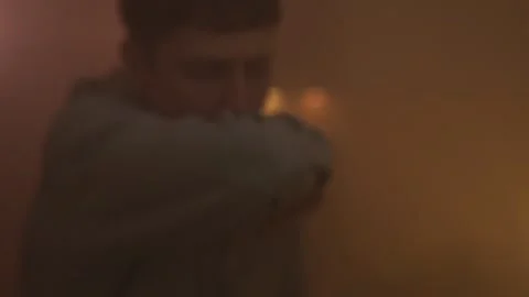 Man suffocating in smoke during a house fire Stock Footage 305307688