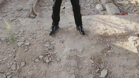 Man in suit aiming a gun at the camera and shoot Stock Footage 66877375