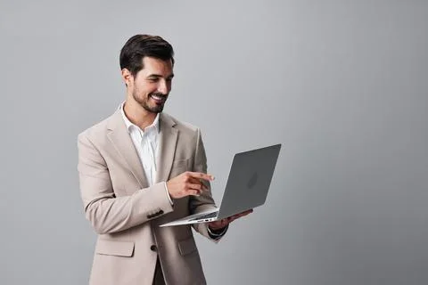 Man suit beard laptop computer copyspace freelancer smiling internet job Stock Photos