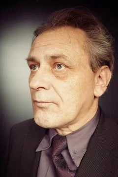 Man in suit on black background Stock Photos