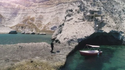 Man in suit with briefcase walking up stone steps while talking on his Video stock 77898172