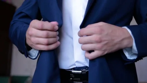 Man in suit buttoning his jacket Stock Footage 73142418