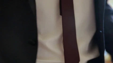 Man in suit buttoning his jacket Stock Footage 82184092
