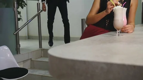 Man in a suit came on a date to his girlfriend in a cafe Stock Footage 75807617
